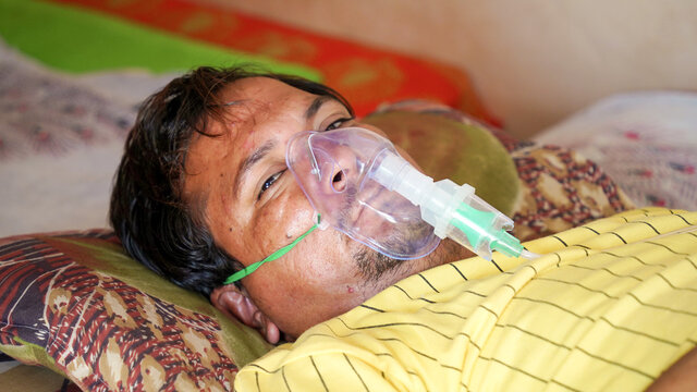 Young Boy wearing oxygen mask COVID 19 concept.