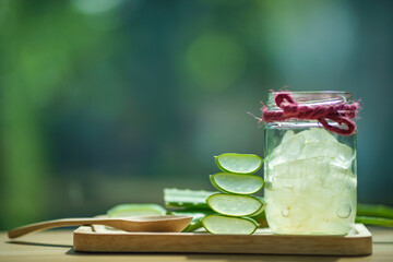 fresh aloe vera leaves and aloe vera gel in glass