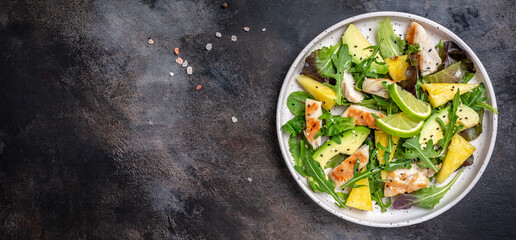 Grilled chicken breast with pineapple and avocado. Salad with lime sauce. Healthy dinner. bowl lunch. Long banner format, top view