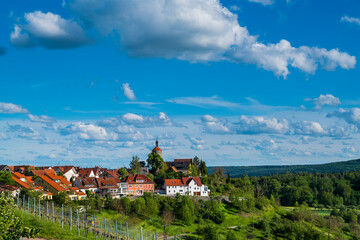 Germany, Winneden buerg city urban district houses next to green nature landscape of forest and green trees in springtime