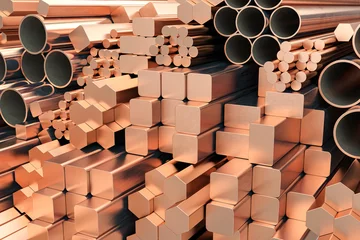 Foto op Plexiglas Copper tubes and different profiles in warehouse background. Different copper metal rolled products. © Maksym Yemelyanov
