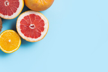 citrus fruits on a blue background. Orange, grapefruit. Top view, flat lay