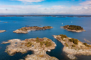 Fototapeta premium Small island with a sailboat harbor in Finland