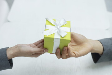 Close up of couple holding gift box