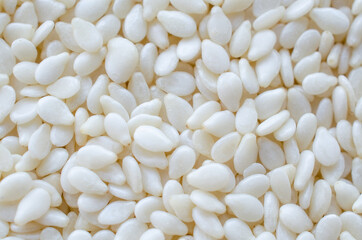 Macro dry organic white sesame seed background, for clean food ingredient or agricultural product concept