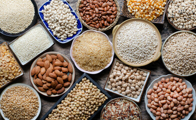 Top view of dry organic cereal and grain seeds in wooden and ceramic bowl on grunge wooden background in dark tone, for clean food ingredient or agricultural product concept