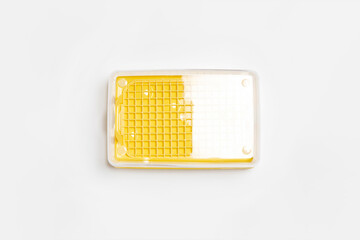 Plastic food container with transparent lid. High-resolution photo.