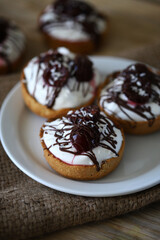 Delicious tartlets with mascarpone cheese, cherries and chocolate. Healthy dessert.