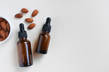 Serum oil for the face with almonds, with a place for text entry. Skin care. Almond Extract Cosmetic. Copy space.