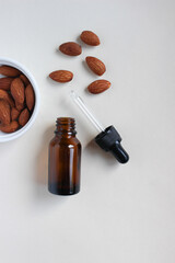 Serum oil for the face with almonds, with a place for text entry. Skin care. Almond Extract Cosmetic. Copy space.