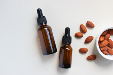 Serum oil for the face with almonds, with a place for text entry. Skin care. Almond Extract Cosmetic. Copy space.