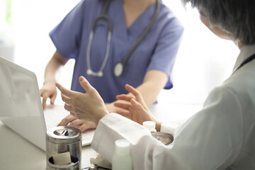 Doctors discussing something in office