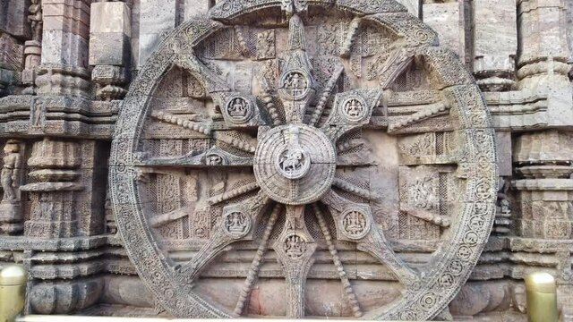 Sun Dial - A time measuring stone wheel engraved on the walls of 800 year old Sun Temple, Konark, India. The temple is designed as a chariot consisting of 24 such wheels. Unesco World Heritage. 