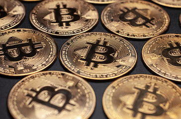 bitcoin gold coins cryptocurrency isolated on black background, selective focus pattern