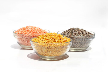 Pulses, Lal Masoor Dal, Kali Masoor, Chana Dal, Pulses, Dal, Beans in glass bowl isolated