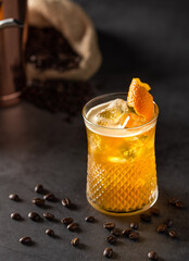 Orange and coffee cocktail on the dark stone background. Shallow depth of field.