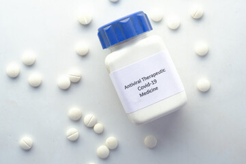  covid 19 medical pills and container on white backgrund 