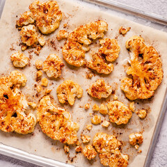 Cauliflower steak with spices cooked in the oven, top view.