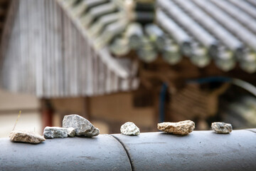 stone on the tile roof
