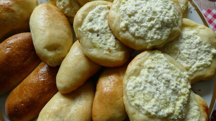 the platter contains pies stuffed with cabbage and cottage cheese 