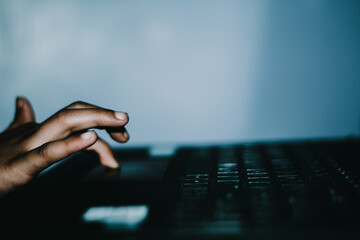 Mockup image of a hand touching on laptop computer touchpad