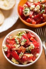Tomatoes, feta basil salad with roll 