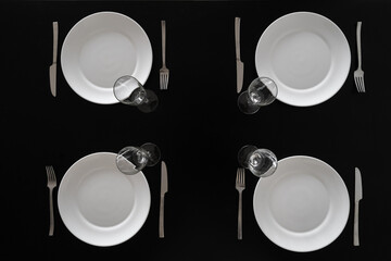 Simple black table setting with white kitchenware