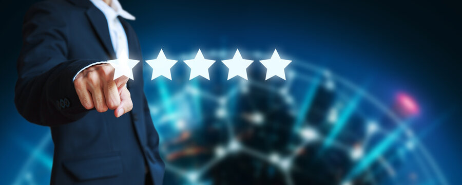 Business man pointing five star icon to give rate of customer service
