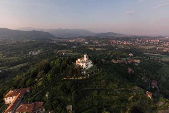 Montevecchia view from the sky with the sanctuary and the hills around at sunset.