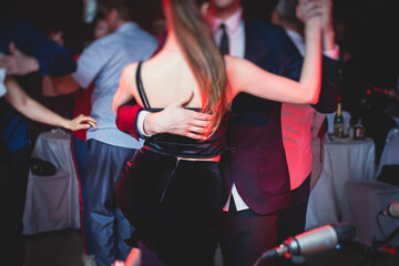 Couples dancing traditional latin argentinian dance milonga in the ballroom, tango salsa bachata...