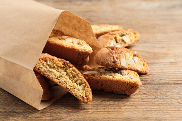 Traditional Italian almond biscuits (Cantucci) on wooden table, closeup