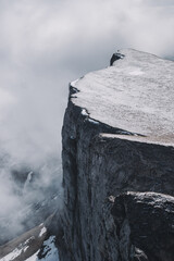 sheer cliff above the abyss. early spring tourist season in Caucasus mountains.