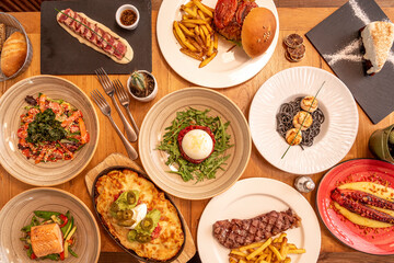 Selection of Italian and Mexican dishes, hamburgers