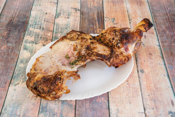 Pork leg almost finished eating that was roasted in the charcoal oven with lots of parsley, garlic and olive oil