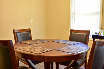 Wooden table and chairs in home dining area