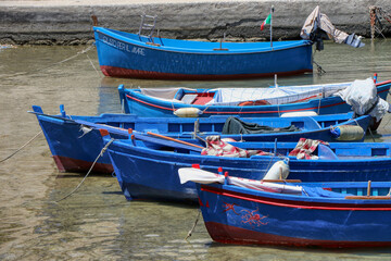 Fototapeta na wymiar Boats moored at the Porto Antico in the old town of Monopoli, Puglia, Italy