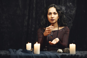Portrait of fortune-teller in a dark room