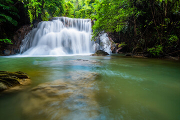 Waterfall and blue emerald water color in Huay Mae Khamin national park. Huay Mae Khamin, Beautiful nature rock waterfall steps in tropical rainforest at Kanchanaburi province, Thailand