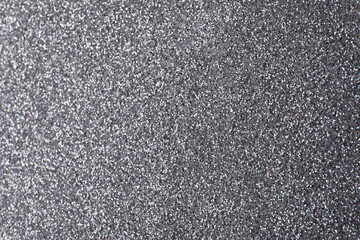 Beautiful shiny grey glitter as background, closeup