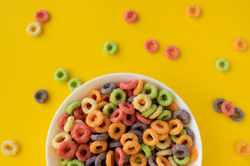 multicolored bright dry breakfast on yellow background
