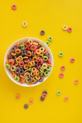 multicolored bright dry breakfast on yellow background