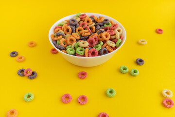 multicolored bright dry breakfast on yellow background