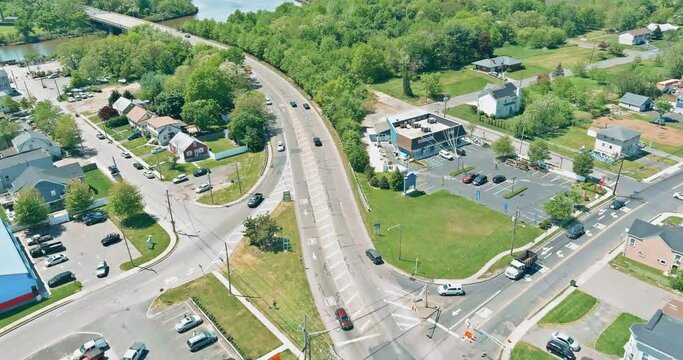 Car drives across bridge over river in aerial view the connected two American Sayreville town New Jersey Middlesex County USA