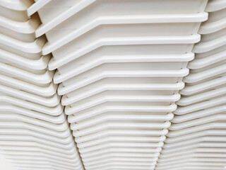 Stack of white plastic container box storage. Plastic containers for home use stack in a store for sale. Houseware store plastic containers.