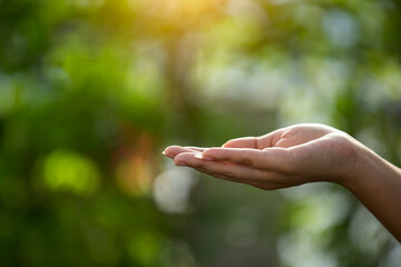 Technology, hand holding with environment Icons over the Network connection on green background.