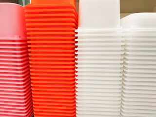 Stack of multi colors plastic container box storage. Plastic containers for home use stack in a...