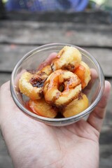 chocolate donut on man hand