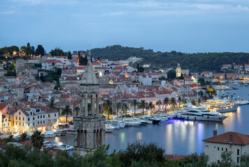Port of Hvar with the view on old part of the city after sunset.