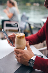 Man holding coffee in hands