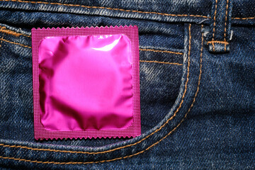 Condom in package in jeans. Men found condoms to prevent sexually transmitted infections or AIDS....